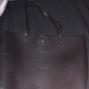 A black reversible shoulder bag, Used for everyday